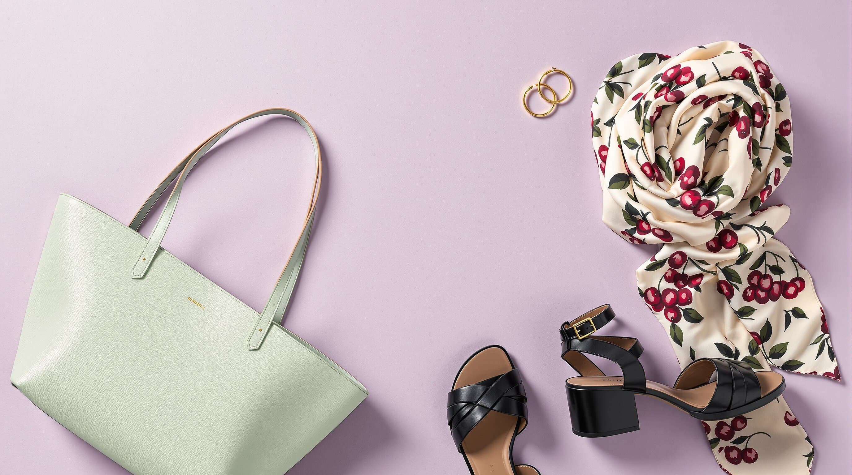 Accessories edit — flat lay on pale lavender